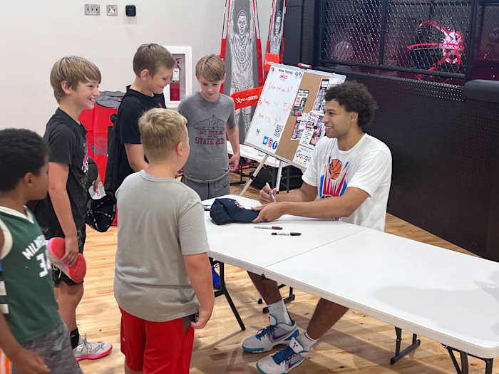 On the last day of camp, Anton Watson spent time taking pictures with his campers and signing autographs.